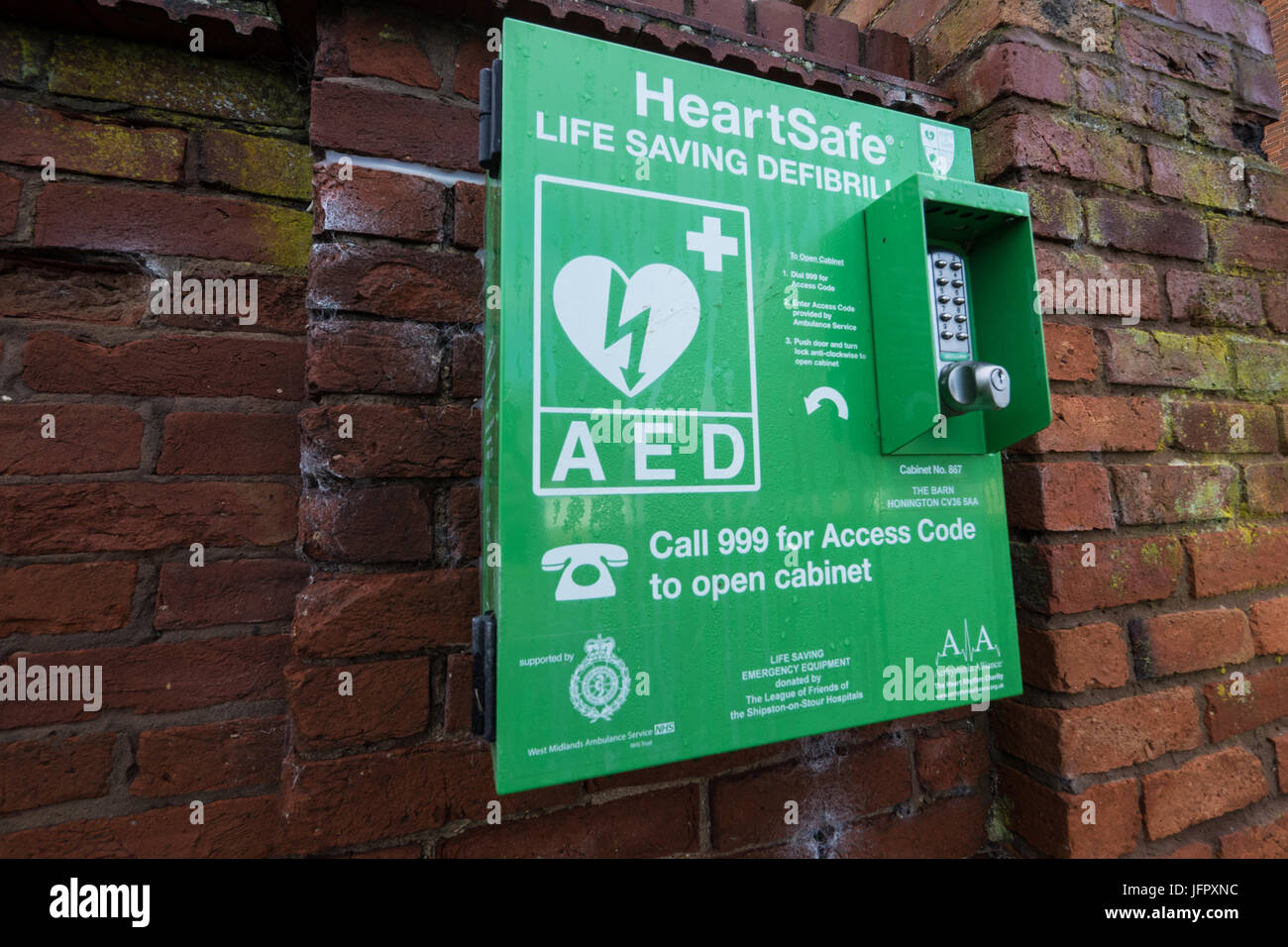 Wall mounted defibrillator for emergency use in times of heart failure or cardiac arrest. Stock Photo