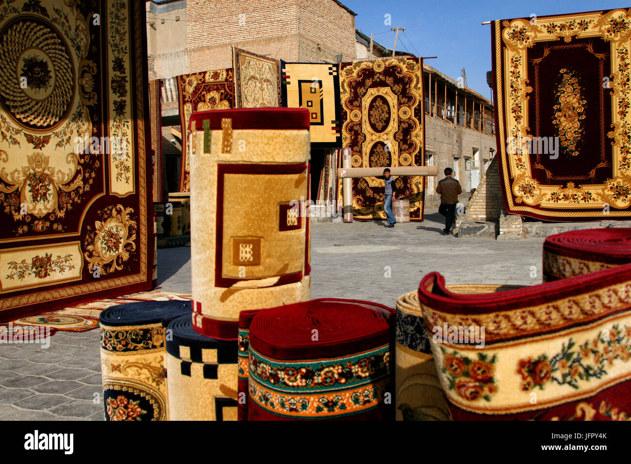 Bukhara, UZBEKISTAN - March 08, 2009: Sale of carpets on the market in Bukhara Stock Photo