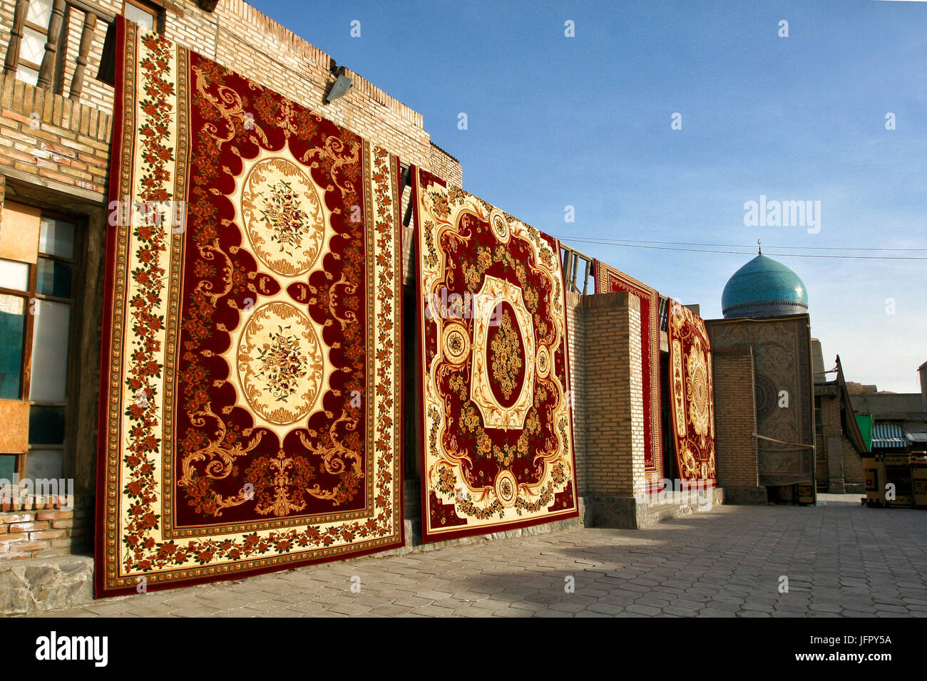 Sale of carpets on the market in Bukhara, Uzbekistan Stock Photo