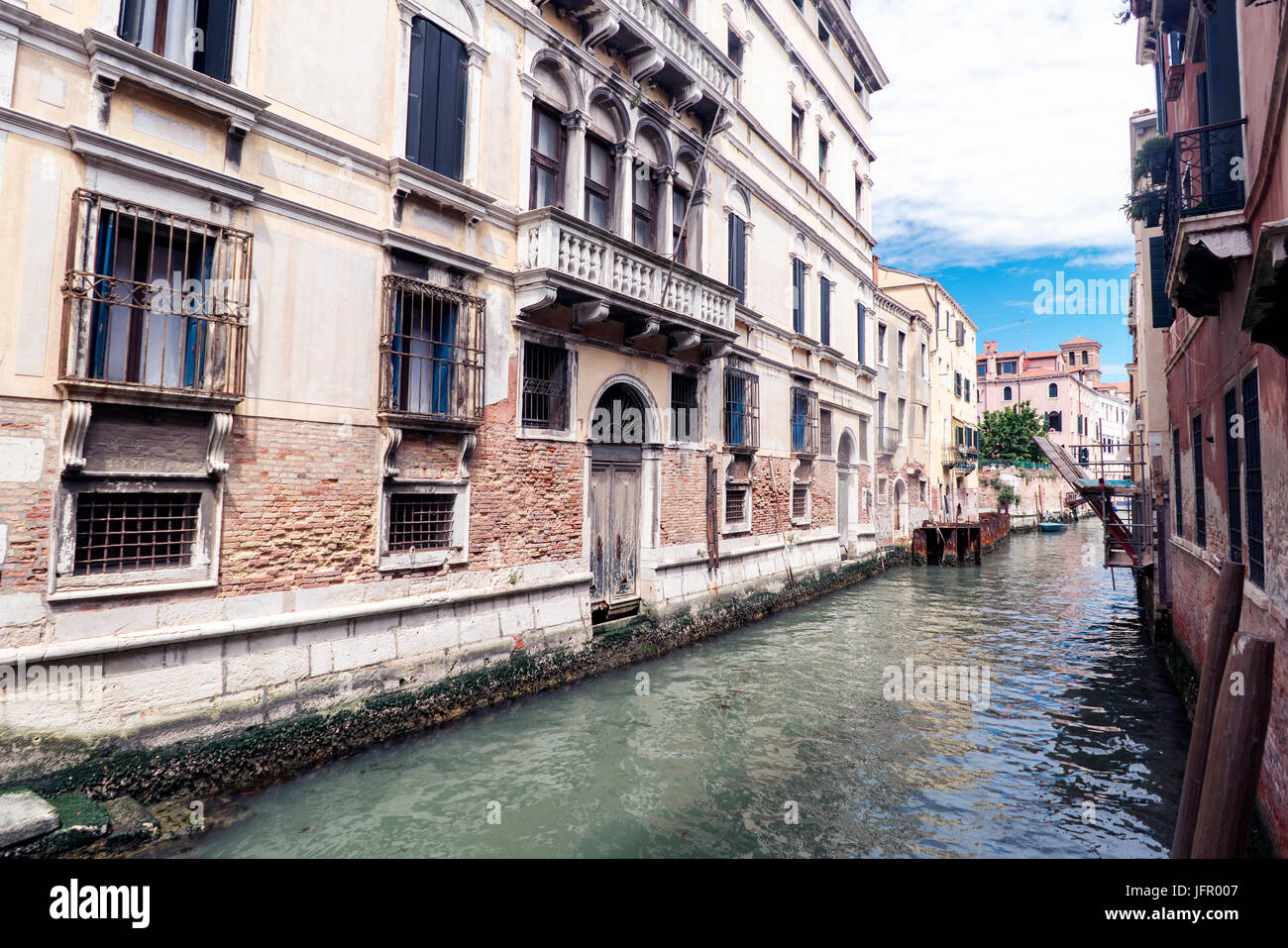 Venice, Veneto / Italy- May 21, 2017: View of the canal from a bridge in the street called 'Rio tera Barba Futariol' in the oldest part of the island  Stock Photo
