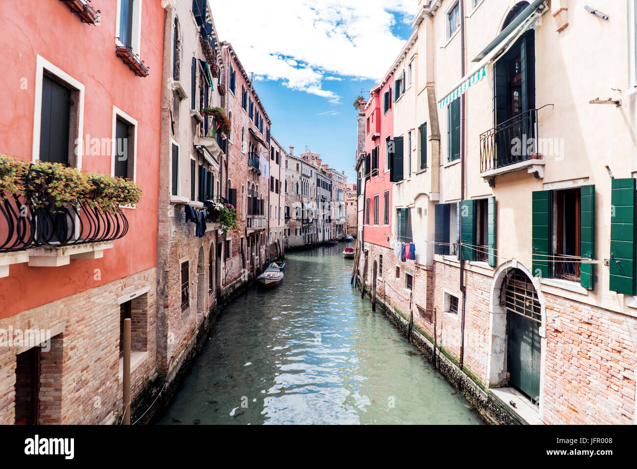 Venice, Veneto / Italy- May 21, 2017: View of the canal from a bridge in the street called 'Rio tera Barba Futariol' in the oldest part of the island  Stock Photo