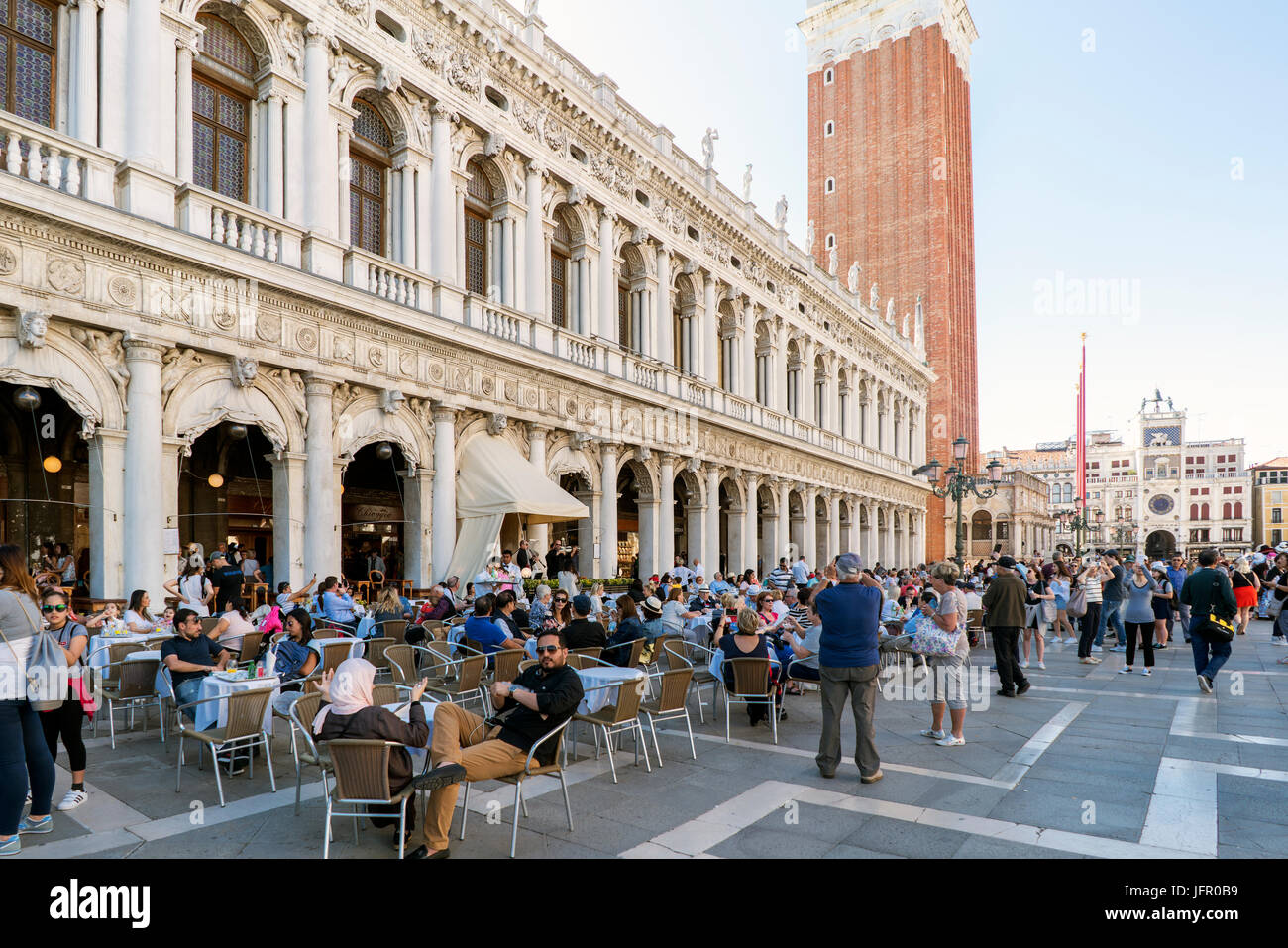 Venice, Veneto / Italy. May 21, 2017: Terraces with people drinking at the Gran Cafe Chioggia in St. Mark's Square Stock Photo