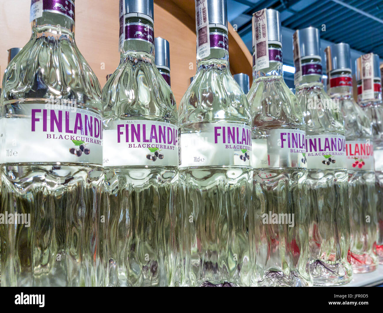 Gorlice, Poland - June 23, 2017: Variety of Natural Flavoured Finlandia Vodka on store shelves for sale in Kaufland Hypermarket. Finlandia is a famous Stock Photo