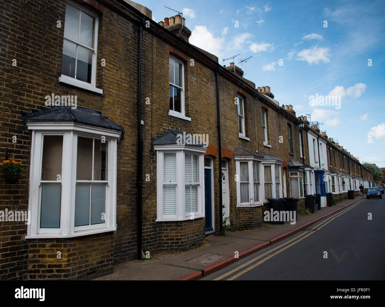 Traditional british houses with white windows at a neighborhood of  the city of Canterbury, Kent, United Kingdom Stock Photo