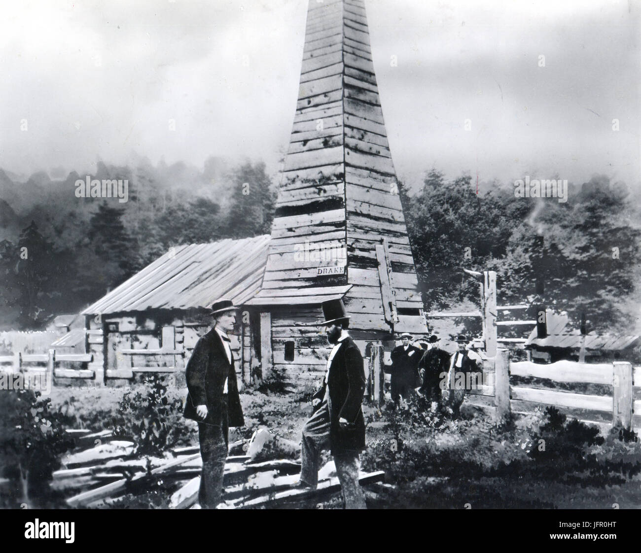 The original Drake oil well. Col. Drake in the right foreground. This was the first oil well in the US which began operating in 1859. Titusville, PA, 1861 Stock Photo