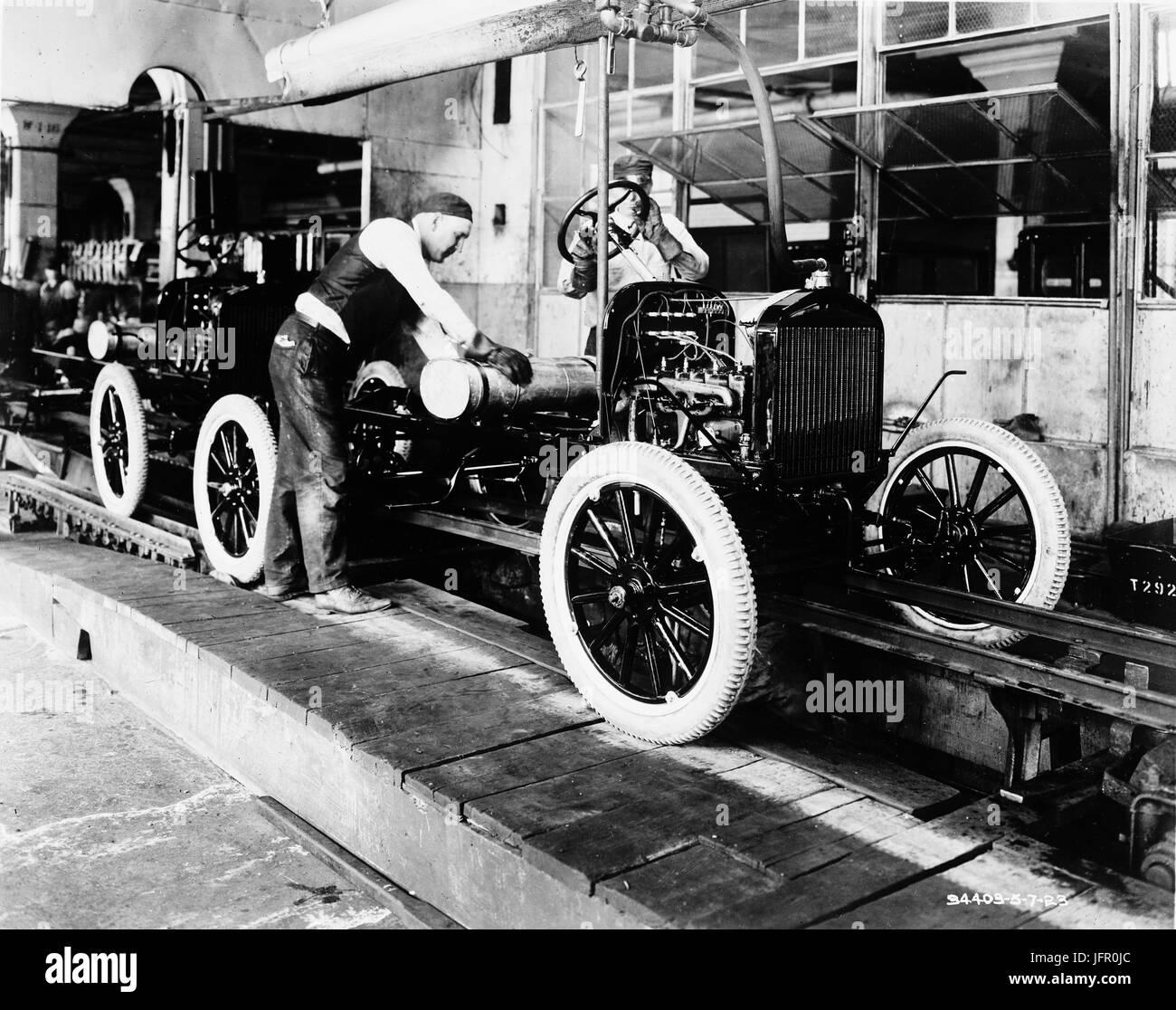 Assembling an automobile, circa 1923 Stock Photo