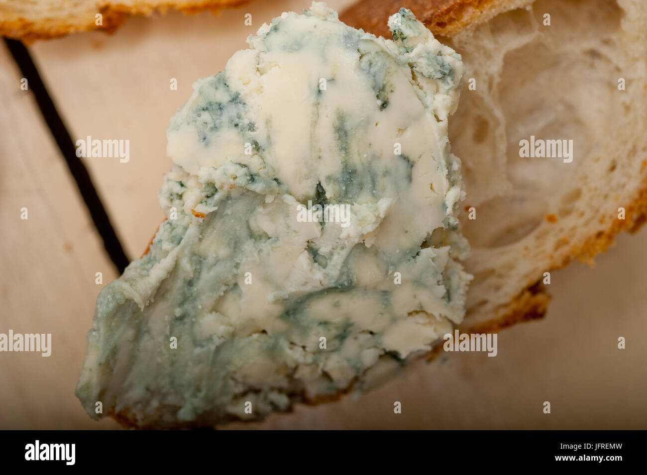 fresh blue cheese spread ove french baguette Stock Photo