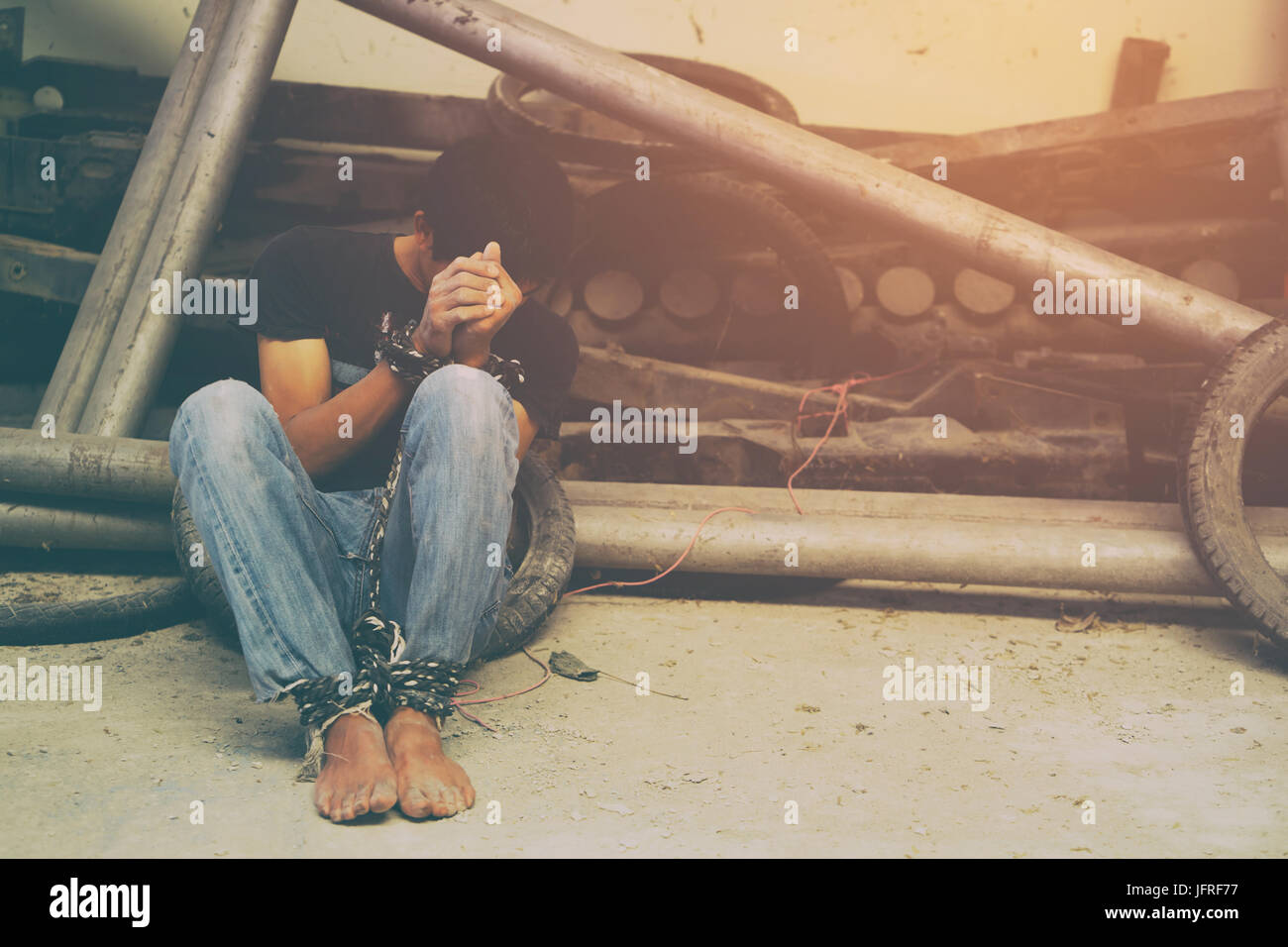 human trafficking, hands tied together with rope Stock Photo