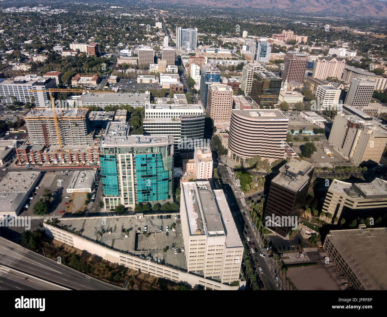 An aerial view of downtown San Jose looking down Santa Clara street towards the East foothills. Stock Photo