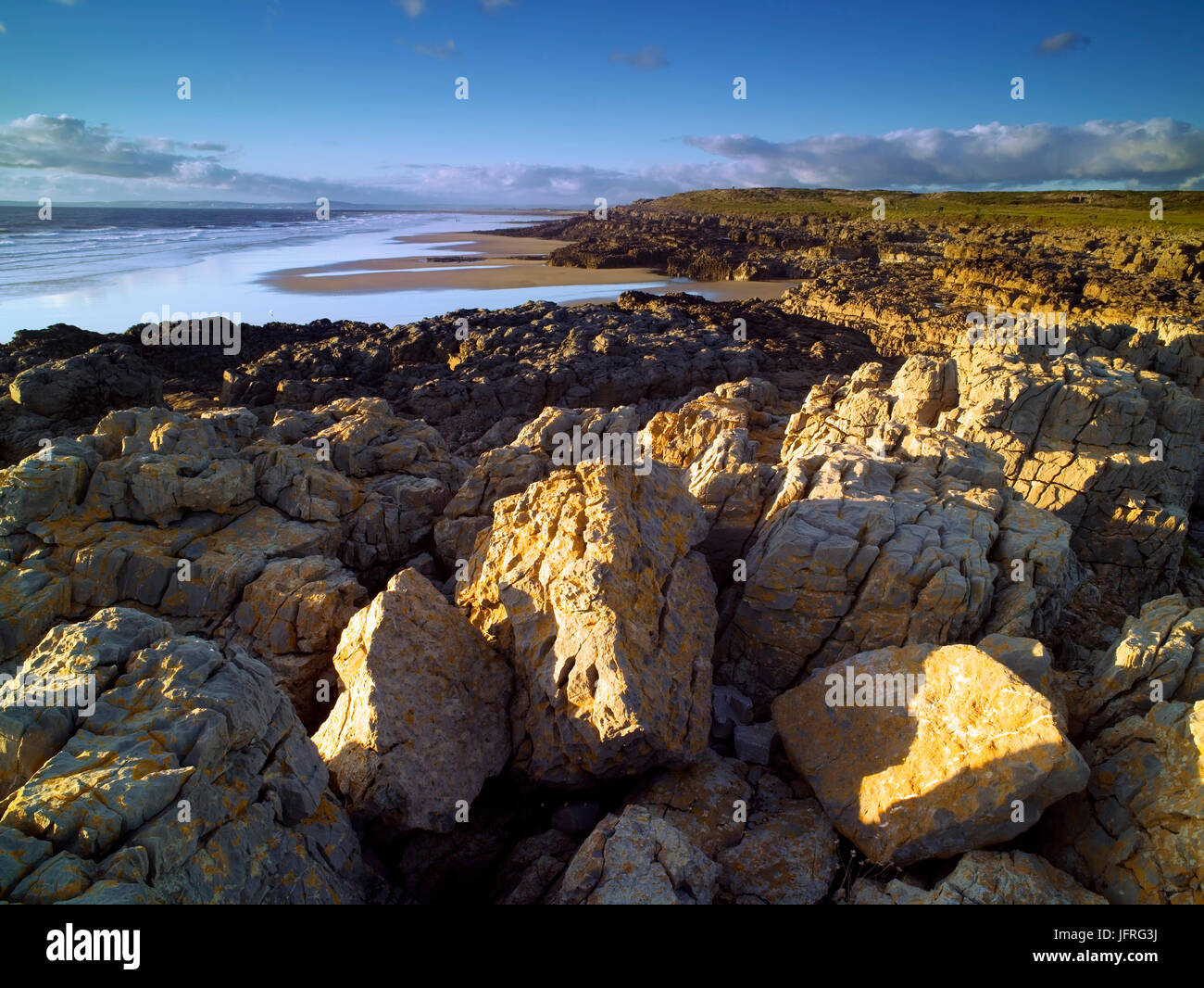 An evening view of Rest Bay, Porthcawl, Vale of Glamorgan, as the sun sets Stock Photo