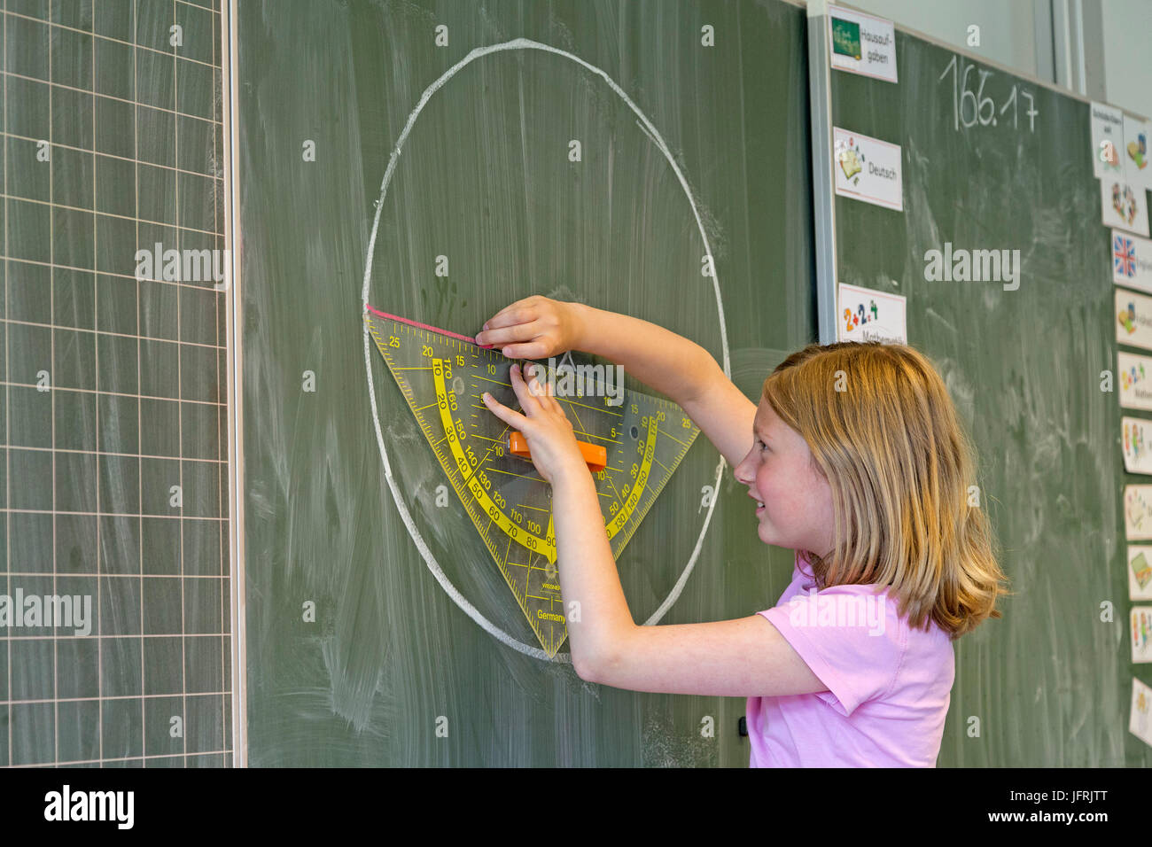 girl at the board at primary school Stock Photo - Alamy