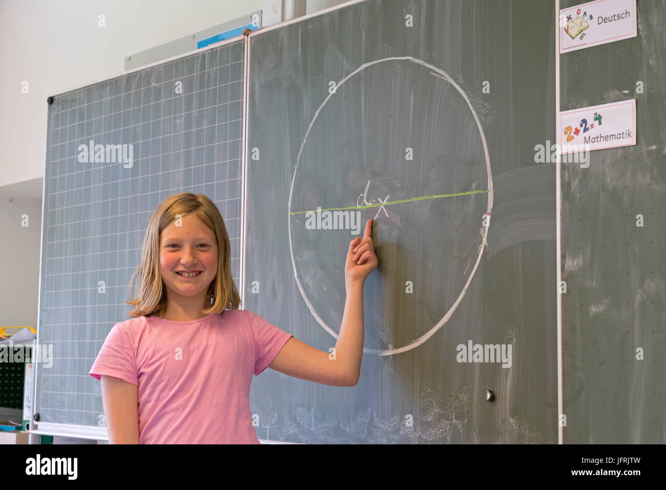 girl at the board at primary school Stock Photo - Alamy