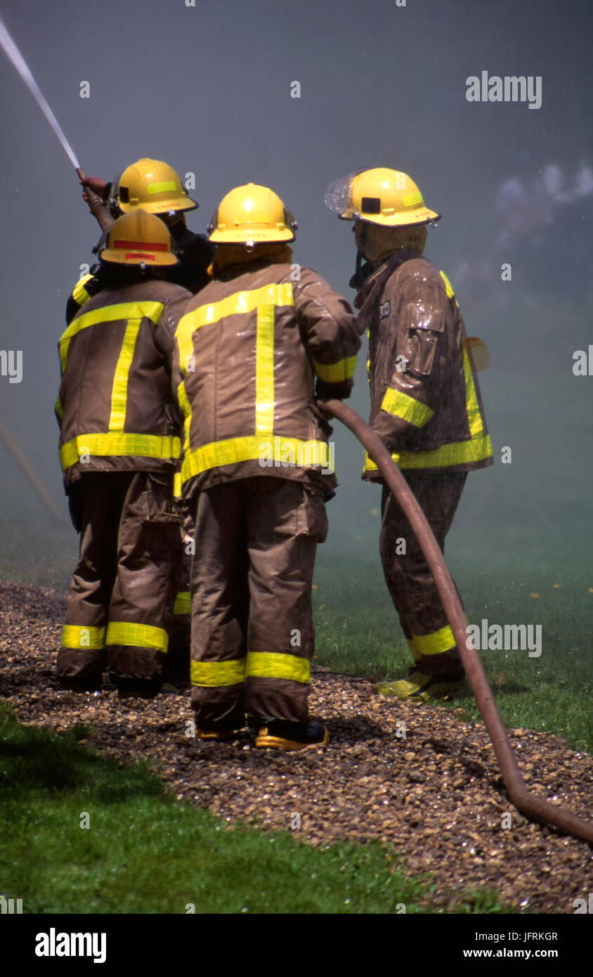 Firefighters in simulation training Stock Photo