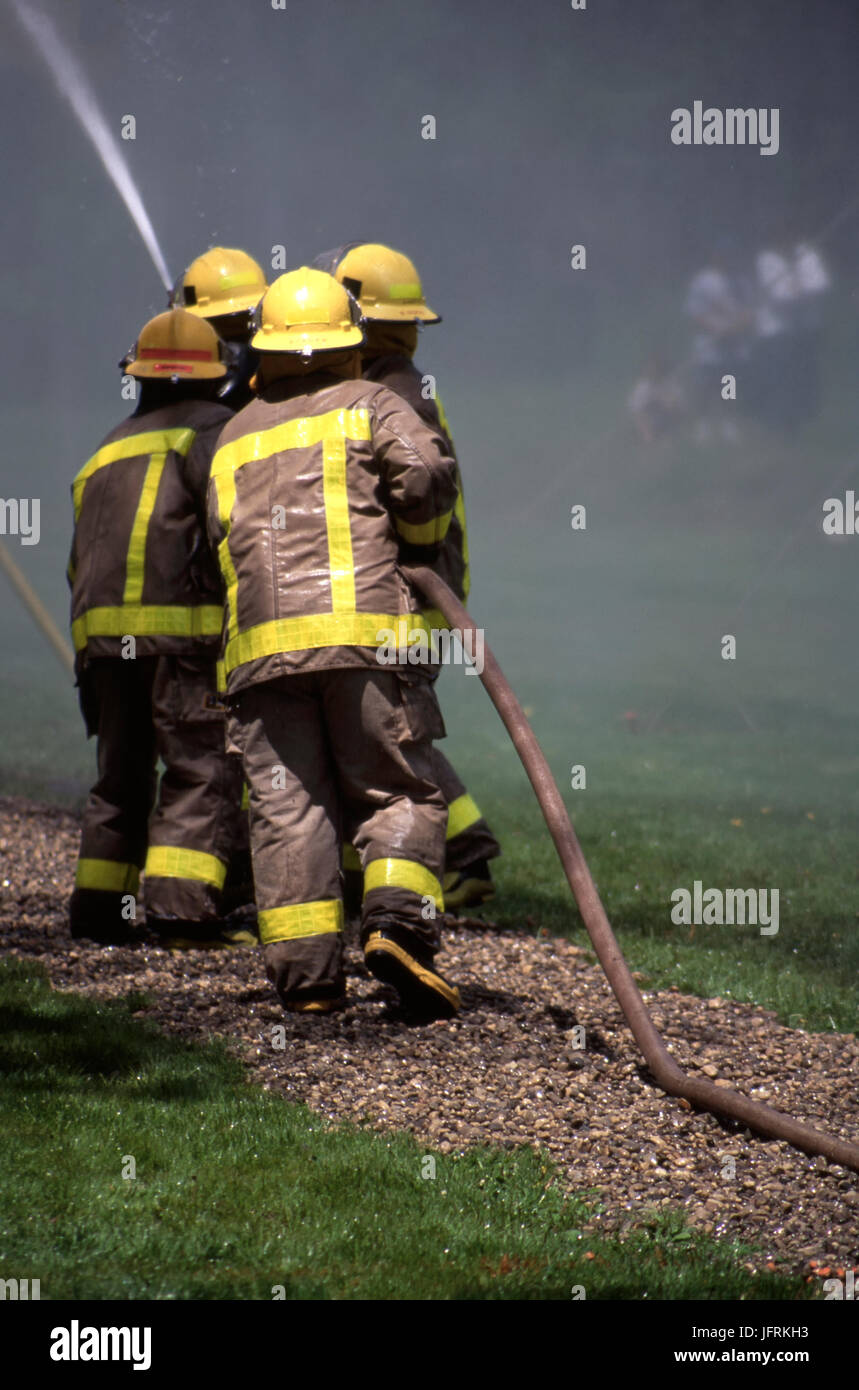 Firefighters in simulation training Stock Photo
