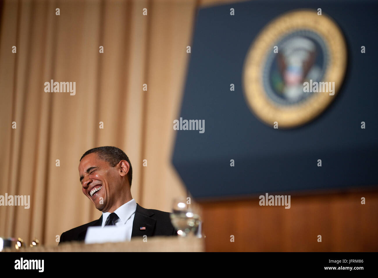 President Barack Obama reacts to a comment made at the White House Correspondents Awards Dinner in Washington, Saturday, May 9, 2009. Official White House Photo by Lawrence Jackson.  This official White House photograph is being made available for publication by news organizations and/or for personal use printing by the subject(s) of the photograph. The photograph may not be manipulated or used in materials, advertisements, products, or promotions that in any way suggest approval or endorsement of the President, the First Family, or the White House. Stock Photo