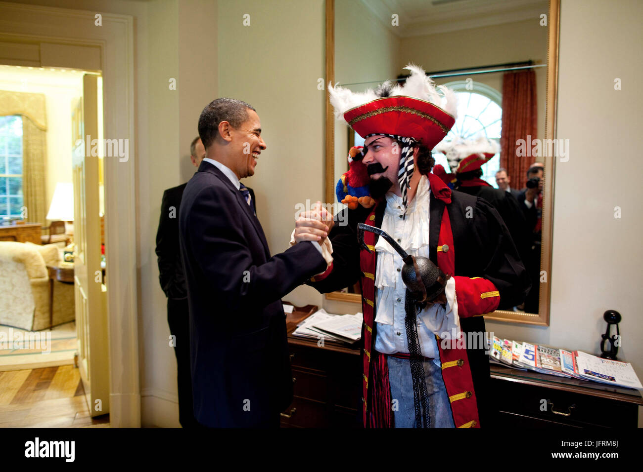 President Barack Obama reacts to seeing speechwriter Cody Keenan dressed up as Captain Hook.  Keenan dressed as a pirate for an Oval Office photo shot for use in the PresidentÕs speech to the White House Correspondents Association dinner May 9, 2009.  Official White House Photo by Pete Souza.  This official White House photograph is being made available for publication by news organizations and/or for personal use printing by the subject(s) of the photograph. The photograph may not be manipulated in any way or used in materials, advertisements, products, or promotions that in any way suggest a Stock Photo