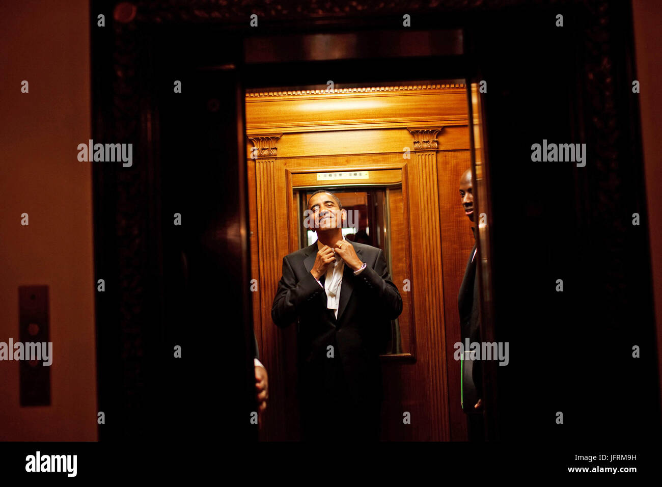 Early in the morning on Jan. 21st, President Barack Obama rides the elevator to the Private Residence of the White House after attending 10 inaugural balls and a long day including being sworn in as President at noon on Tuesday, Jan. 20, 2009.  Official White House Photo by Pete Souza Stock Photo