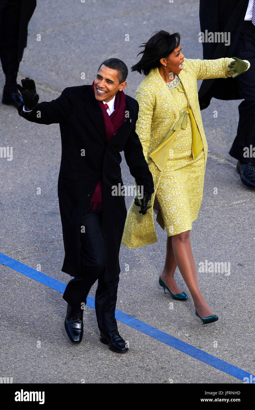 President Barack Obama and first lady Michelle Obama wave to the crowd as they make their way down Pennsylvania Avenue during the 2009 presidential inaugural parade in Washington, D.C., Jan. 20, 2009.  DoD photo by Master Sgt. Gerold Gamble, U.S. Air Force Stock Photo