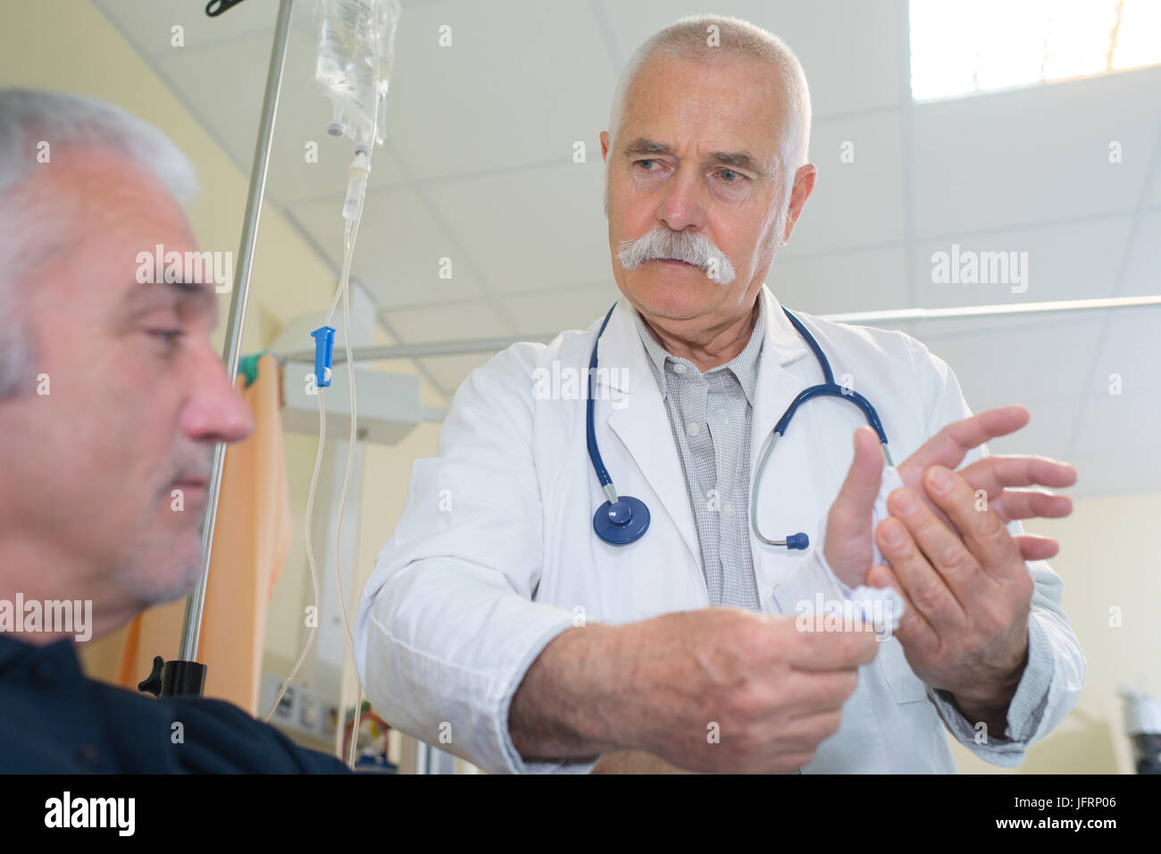 checking for pains in the hand Stock Photo