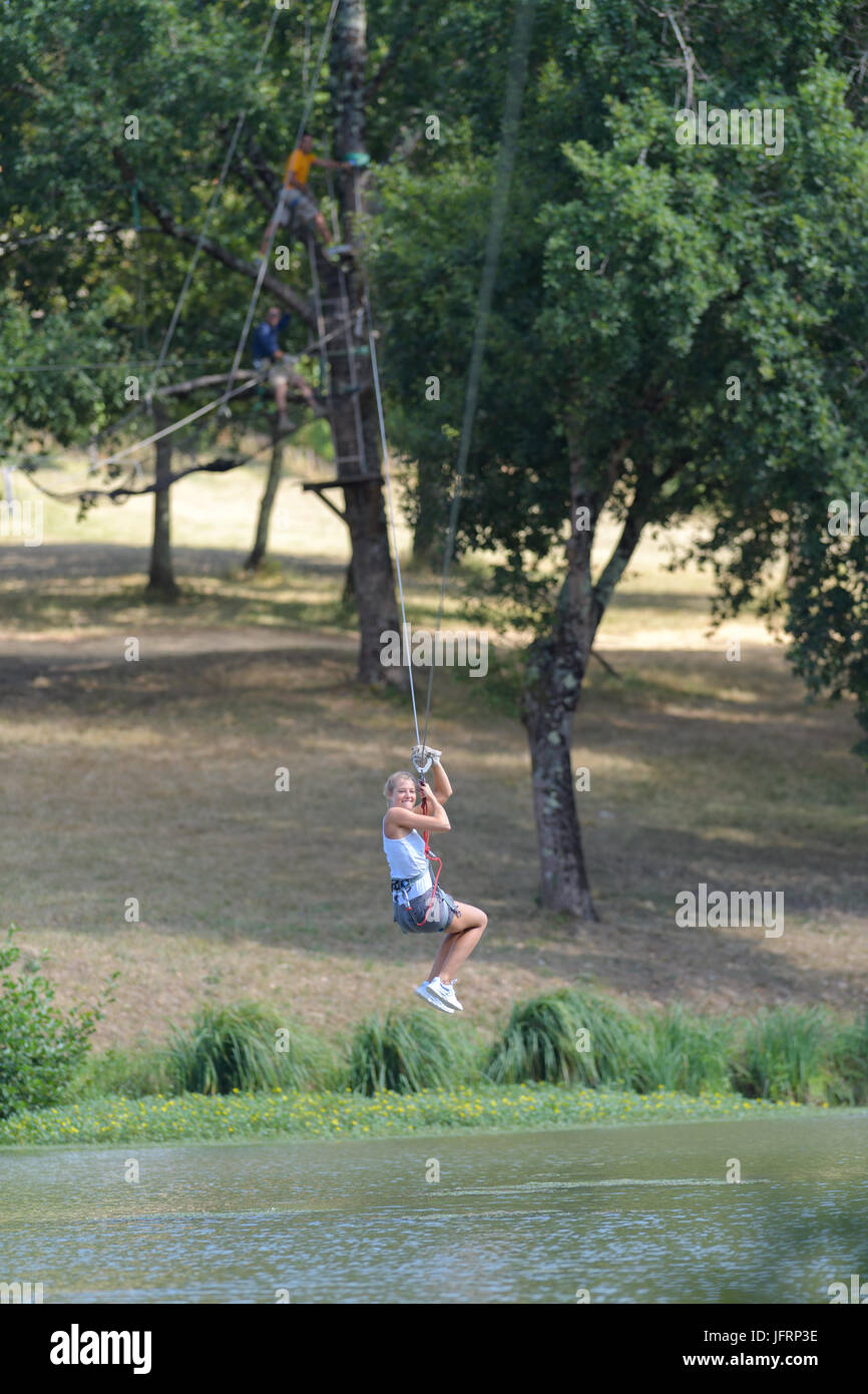 trying the zipline Stock Photo Alamy