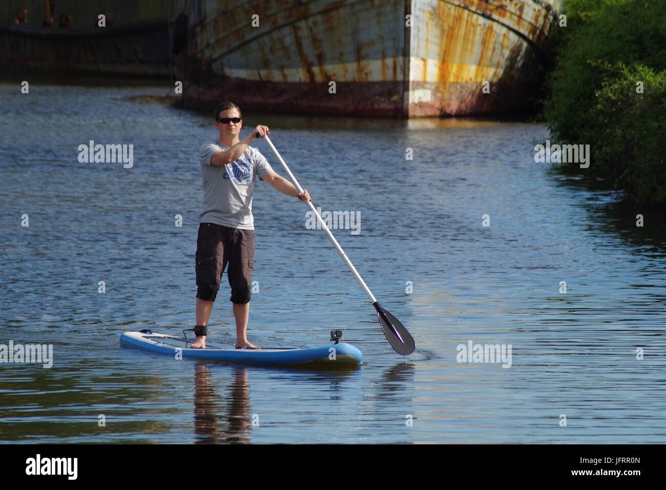 Paddle Boarder on the Exeter Ship Canal. Devon, UK. May, 2017 Stock