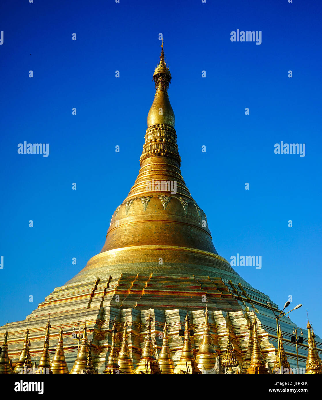 Top of Golden Stupa of Shwedagon Pagoda in Yangon, Myanmar. Shwedagon Pagoda is the most popular and well-known pagoda in Yangon. Stock Photo