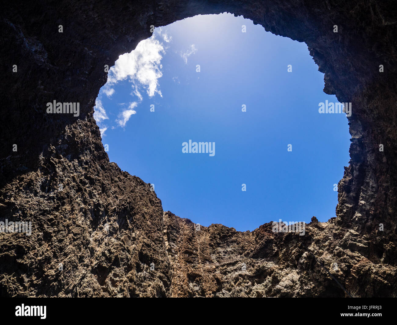 Open ceiling of Eye of Napali Sea Cave from inside, from boat, Napali