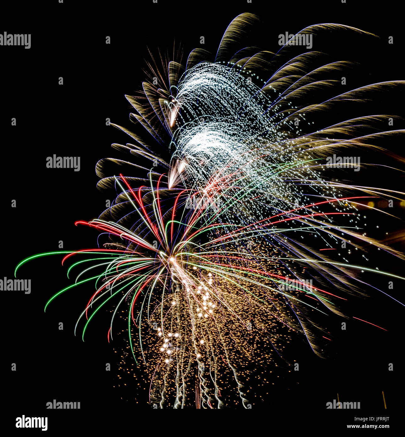 Firework in pink, green, white and red on black background  in graphical color painting style Stock Photo