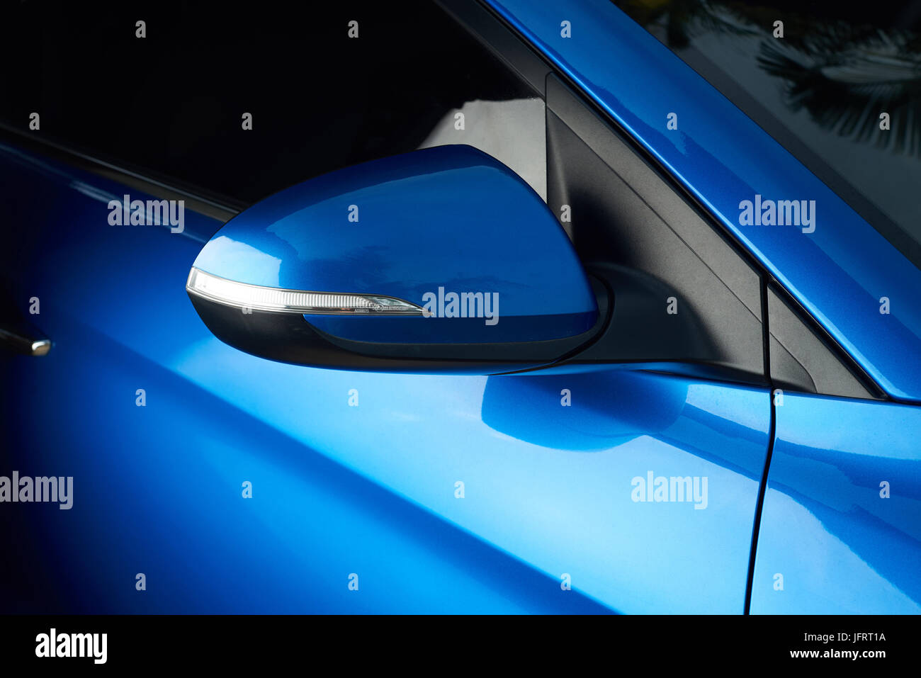 Side car mirror close-up. Details of blue car Stock Photo