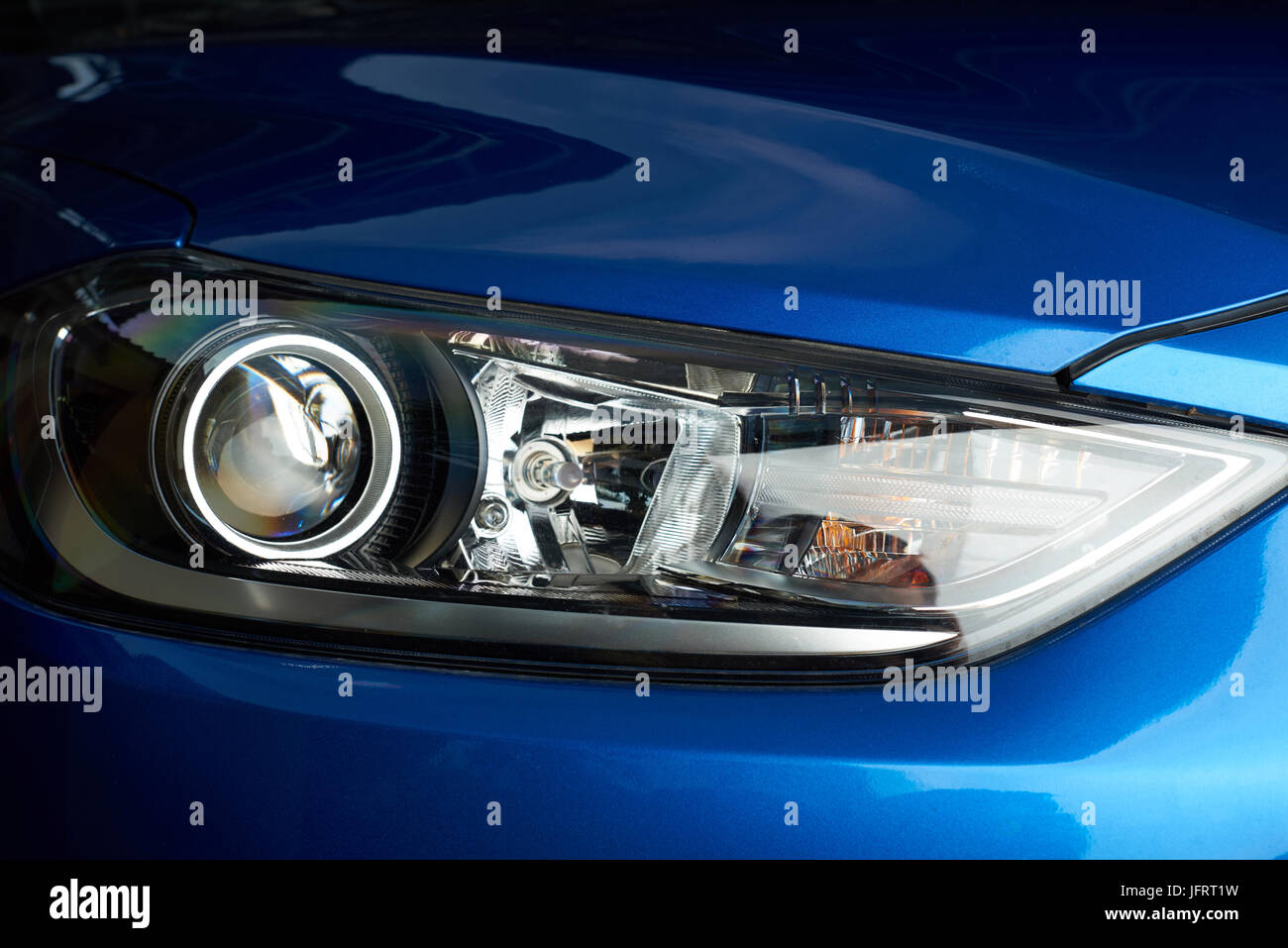 Bright shiny car headlight closeup. New clean led car light Stock
