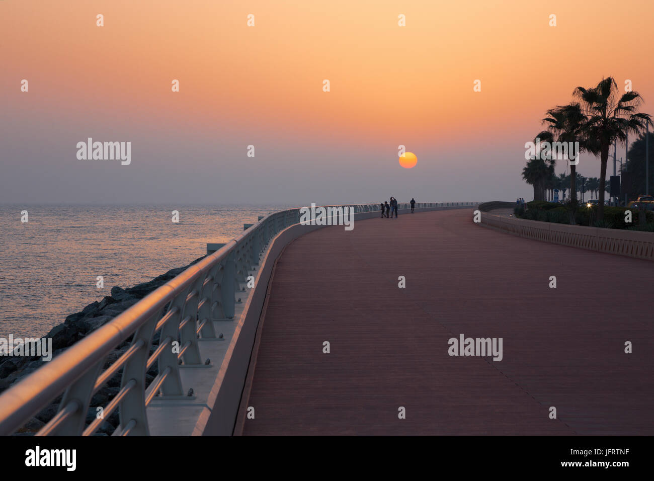 Dubai - The promenade of Palm Island at the sunset. Stock Photo