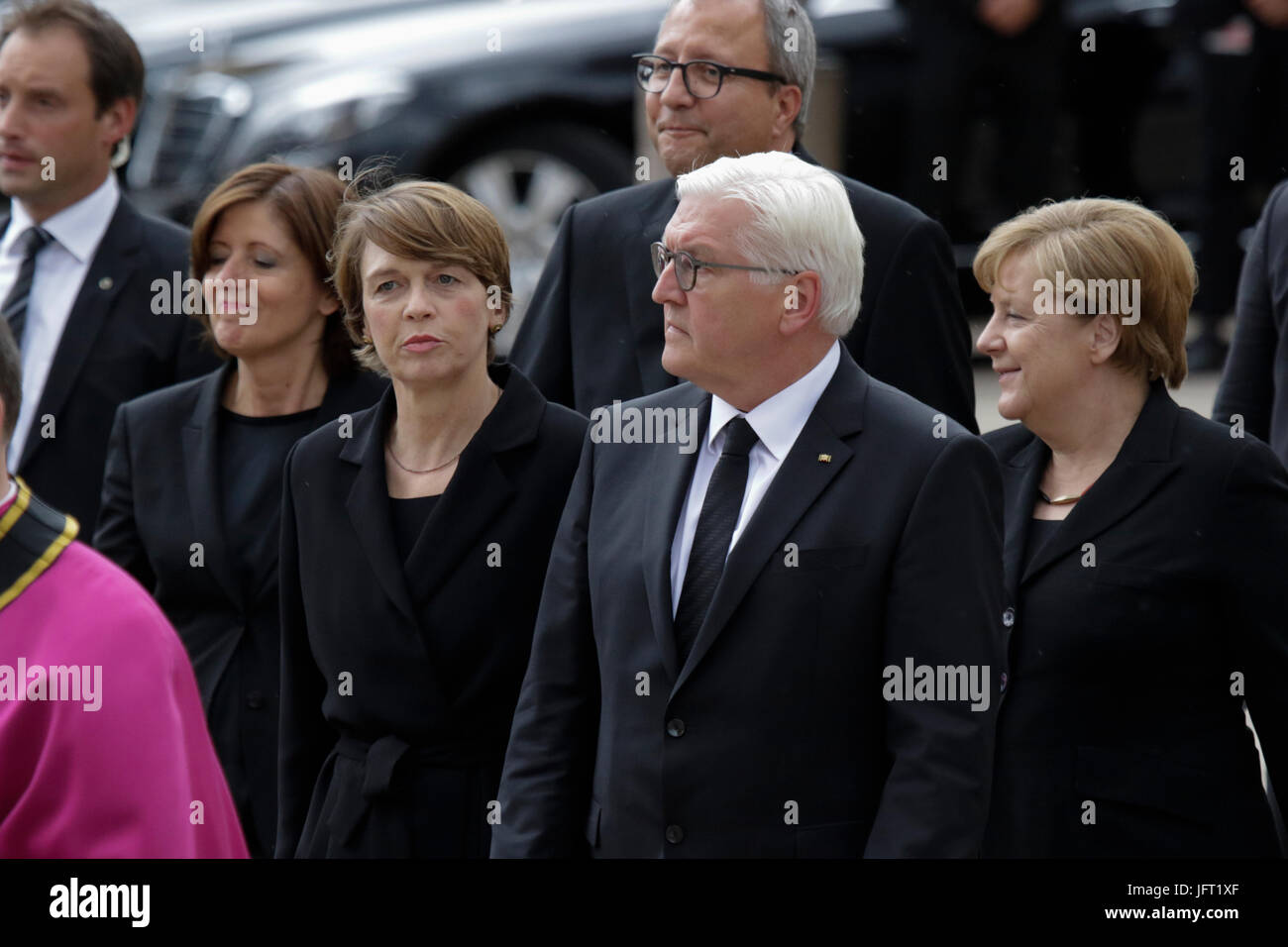 Speyer, Germany. 01st July, 2017. Frank-Walter Steinmeier (centre), the President of Germany, his wife Elke Budenbender (left), Andreas Vosskuhle (centre 2nd row), the President of the Federal Constitutional Court of Germany, and Angela Merkel (right), the Chancellor of Germany, walk to the Speyer Cathedral, A funeral mass for the former German Chancellor Helmut Kohl was held in the Cathedral of Speyer. it was attended by over 1000 invited guests and several thousand people followed the mass outside the Cathedral. Credit: Michael Debets/Pacific Press/Alamy Live News Stock Photo