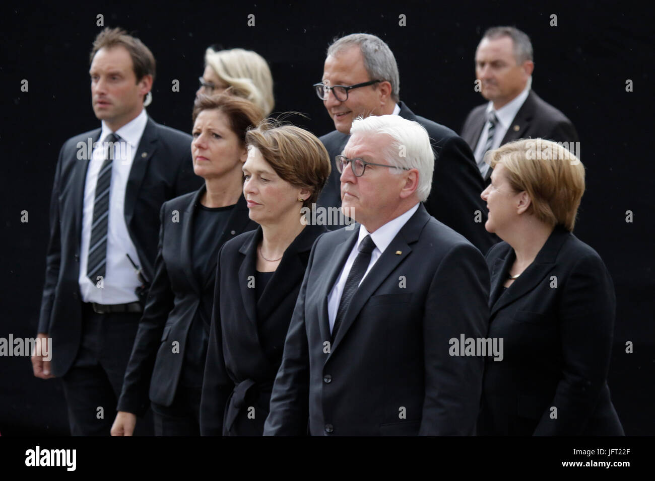 Speyer, Germany. 01st July, 2017. Frank-Walter Steinmeier (centre), the President of Germany, his wife Elke Budenbender (left), Andreas Vosskuhle (centre 2nd row), the President of the Federal Constitutional Court of Germany, and Angela Merkel (right), the Chancellor of Germany, walk to the Speyer Cathedral, A funeral mass for the former German Chancellor Helmut Kohl was held in the Cathedral of Speyer. it was attended by over 1000 invited guests and several thousand people followed the mass outside the Cathedral. Credit: Michael Debets/Pacific Press/Alamy Live News Stock Photo