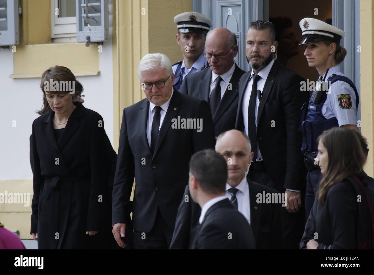 Speyer, Germany. 01st July, 2017. Frank-Walter Steinmeier (2nd left), the President of Germany, his wife Elke Budenbender (left) and Norbert Lammert, the President of the German Bundestag, walk to the Speyer Cathedral, A funeral mass for the former German Chancellor Helmut Kohl was held in the Cathedral of Speyer. it was attended by over 1000 invited guests and several thousand people followed the mass outside the Cathedral. Credit: Michael Debets/Pacific Press/Alamy Live News Stock Photo