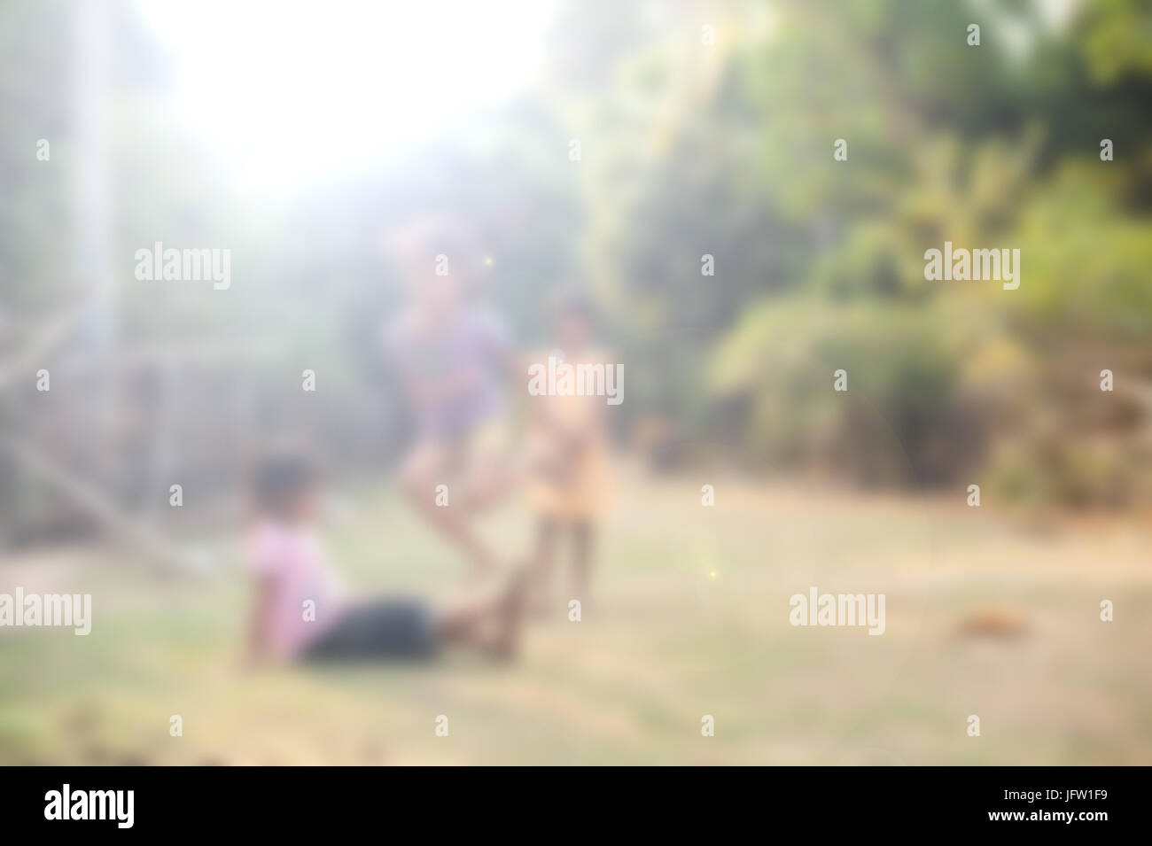 Blurred Children play and fun of kids outdoor in countryside village