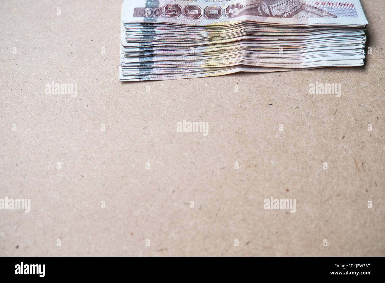 Thai money on brown background Stock Photo