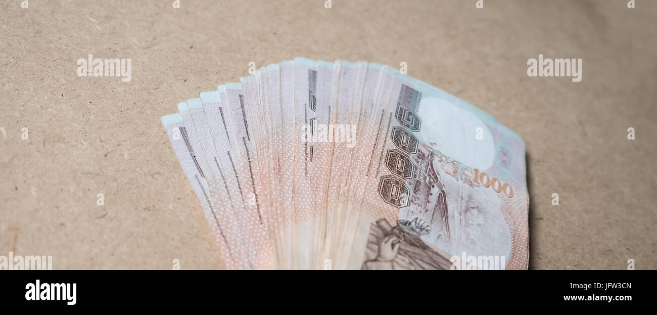 Thai money on brown background Stock Photo
