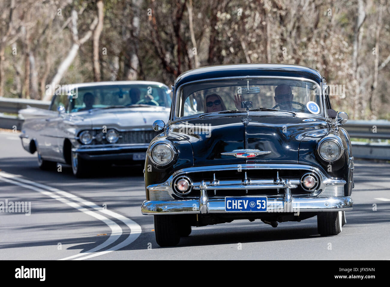 Vintage 1953 Chevrolet Belair Sedan driving on country roads near the town of Birdwood, South Australia. Stock Photo