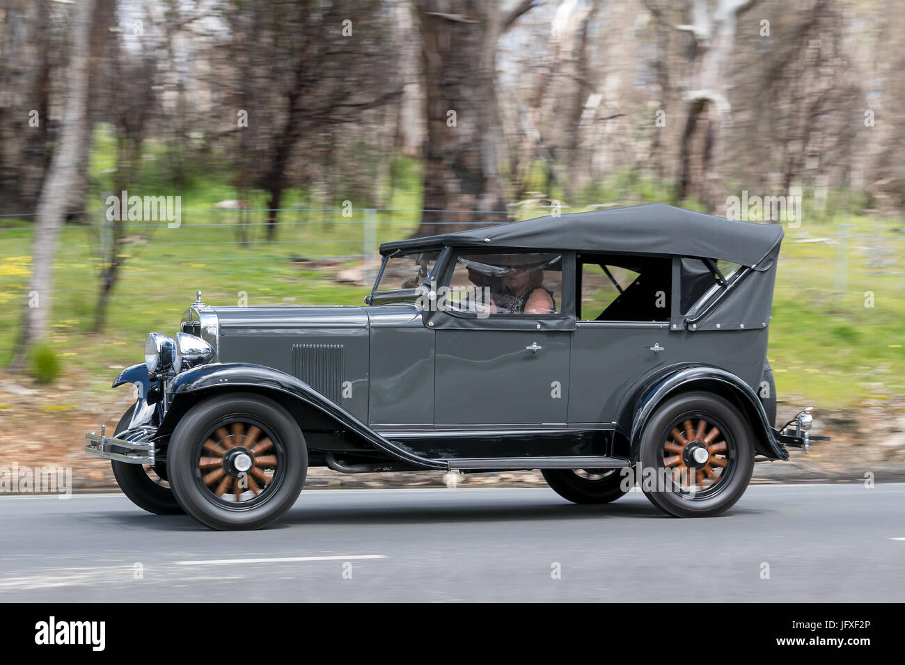 Vintage 1930 Chevrolet Tourer driving on country roads near the town of Birdwood, South Australia. Stock Photo