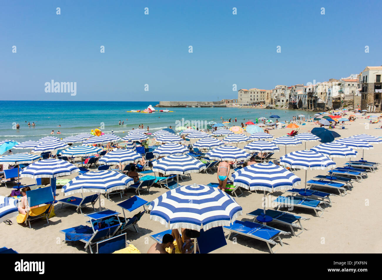 The beach in Cefalù, Sicily. Historic Cefalù is a major tourist destination on Sicily. Stock Photo
