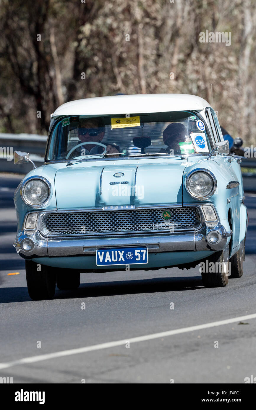 Vintage 1957 Vauxhall Victor sedan driving on country roads near the town of Birdwood, South Australia. Stock Photo