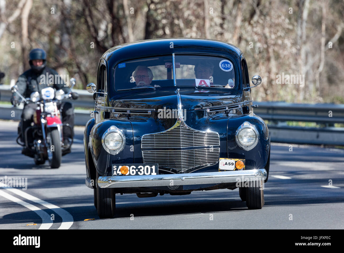 Vintage 1940 Dodge D15 Sedan driving on country roads near the town of Birdwood, South Australia. Stock Photo