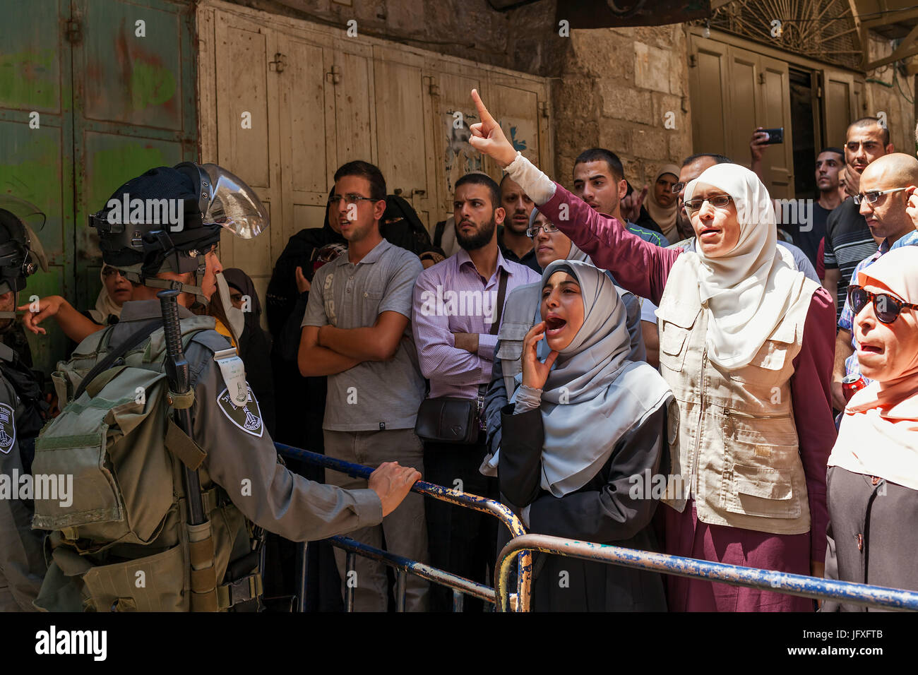 JERUSALEM, ISRAEL - JULY 26, 2015: Palestinians in Old City of Jerusalem protest against ascent of Jews to Temple Mount during Tisha B'Av. Stock Photo