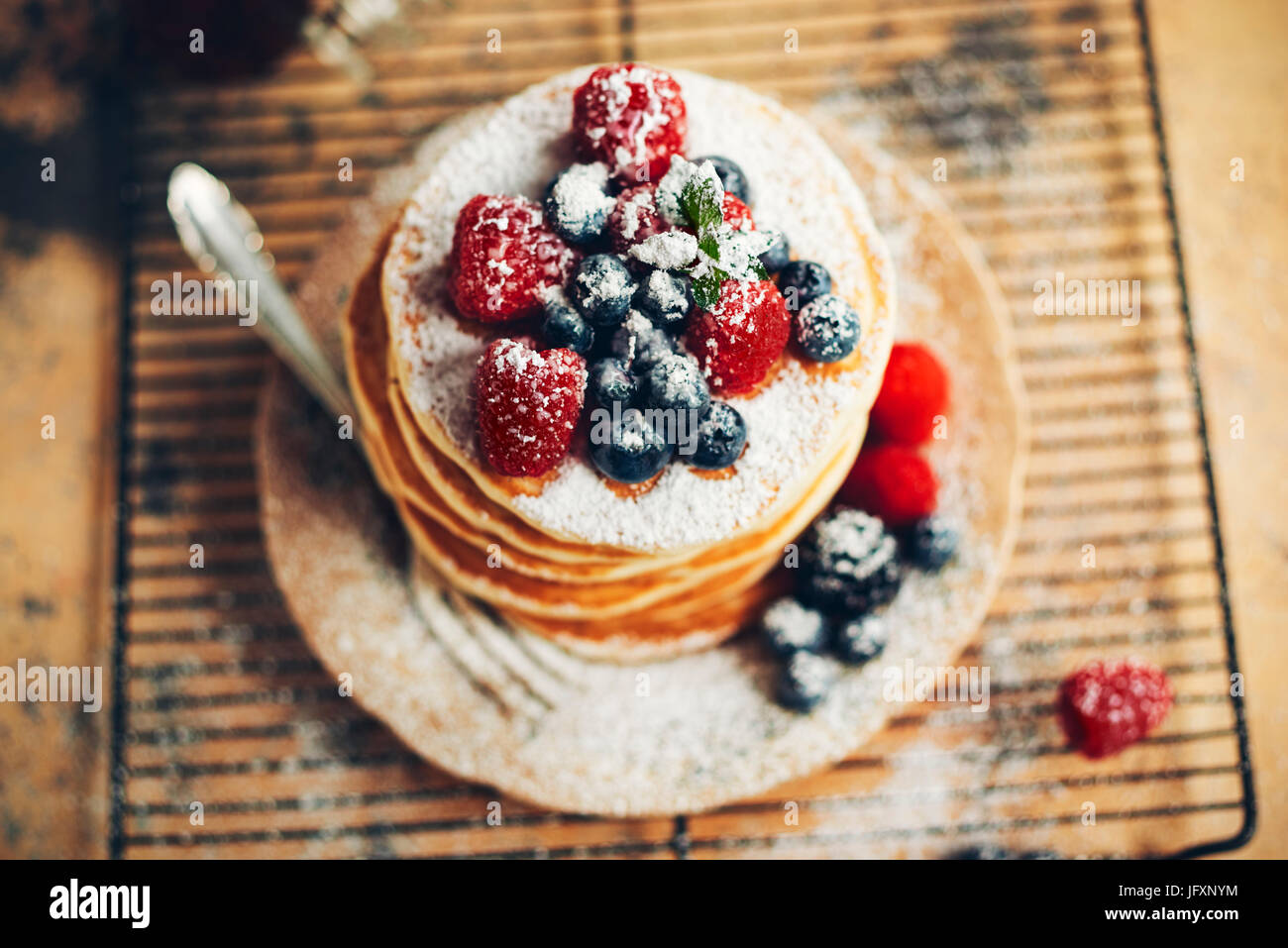 Pancakes Raspberry Blueberries Mint pancakes with blueberries & raspberries Stock Photo - Alamy
