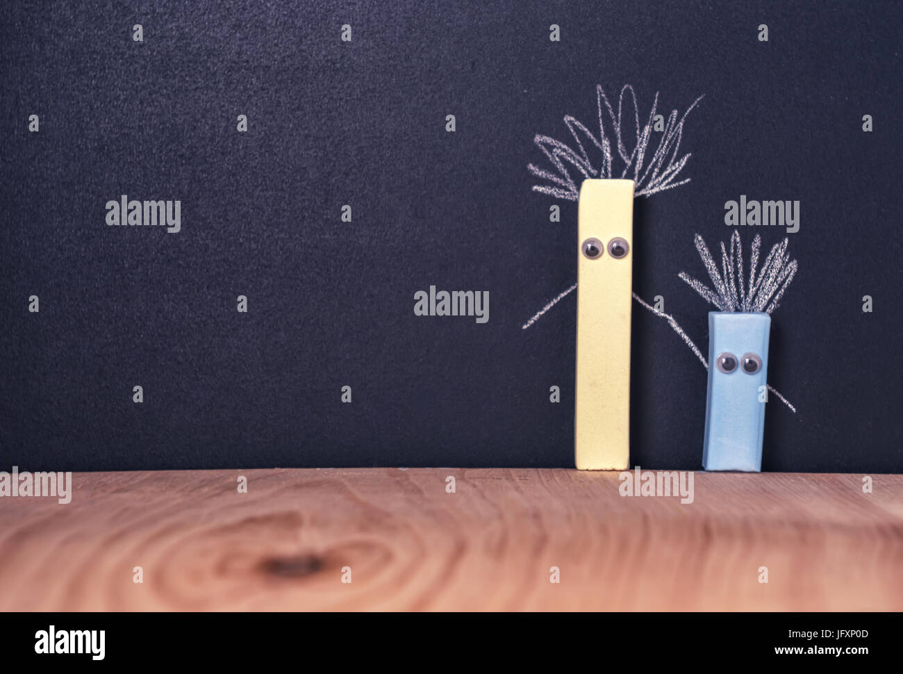 two pieces of chalk with eyes, concept friendship Stock Photo