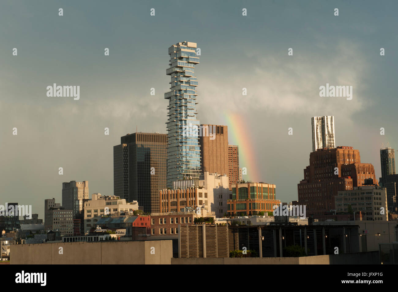 After a storm, a rainbow appeared over Tribeca, a neighborhood in Manhattan dominated by the skyscraper at 56 Leonard St. Stock Photo
