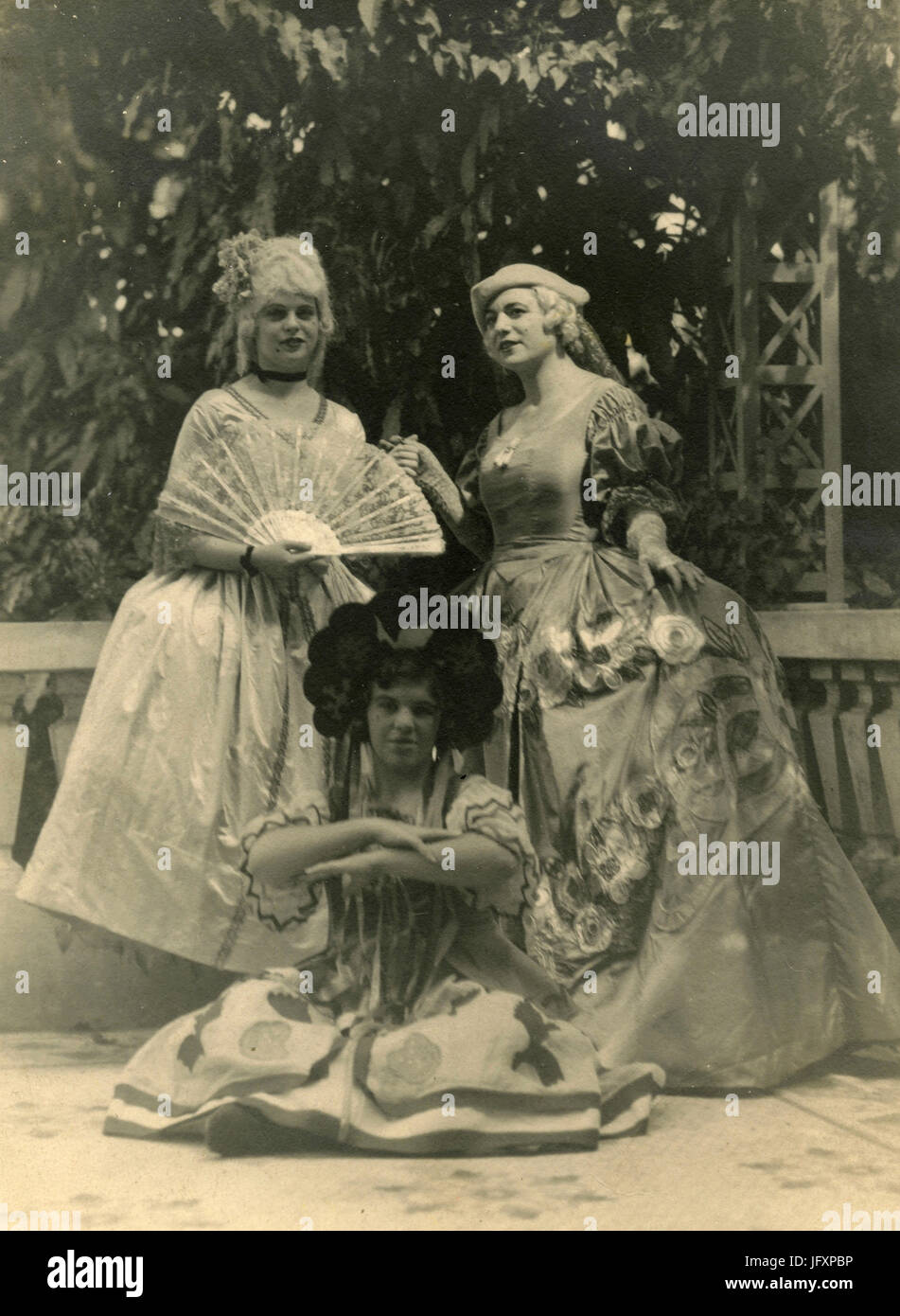 Three girls wearing masks from the 1700s, Italy Stock Photo