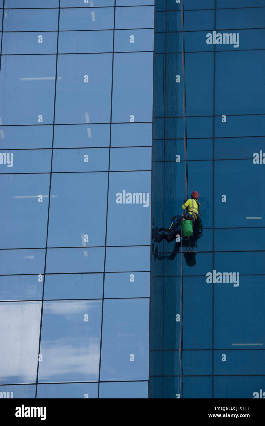 Window washer or cleaner on a huge high rise office buildings Panama Republic of Panama Stock Photo