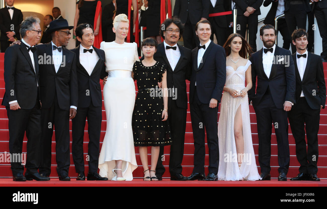 (L-R) Actors Byung Heebong, Giancarlo Esposito, Steven Yeun, Tilda Swinton and Ahn Seo-Hyun, director Bong Joon-Ho and actors Paul Dano, Lily Collins, Jake Gyllenhaal and Devon Bostic  attend the Okja screening during the 70th annual Cannes Film Festival at Palais des Festivals on May 19, 2017 in Cannes, France. Stock Photo