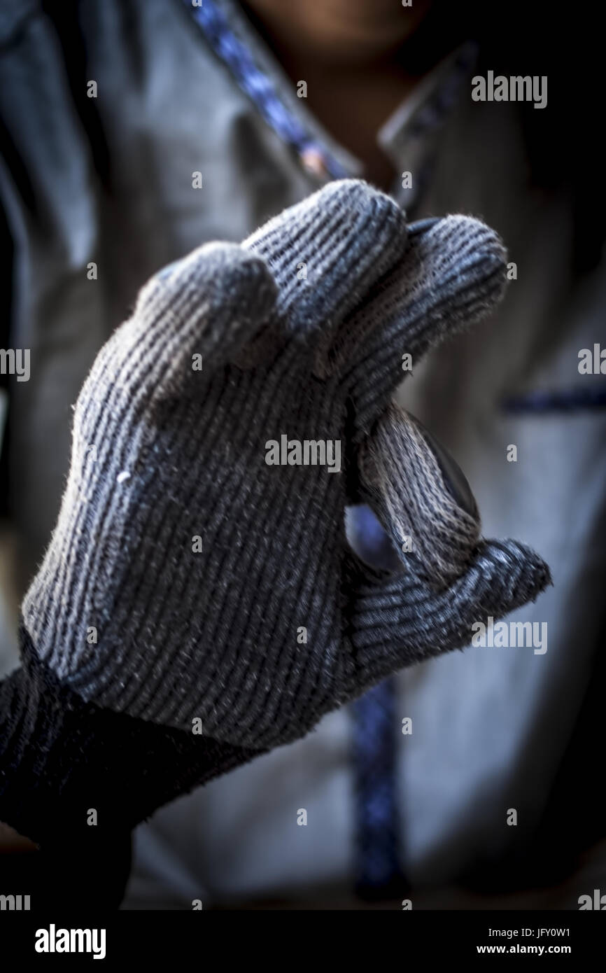 Human hand wearing bikers gloves. Stock Photo
